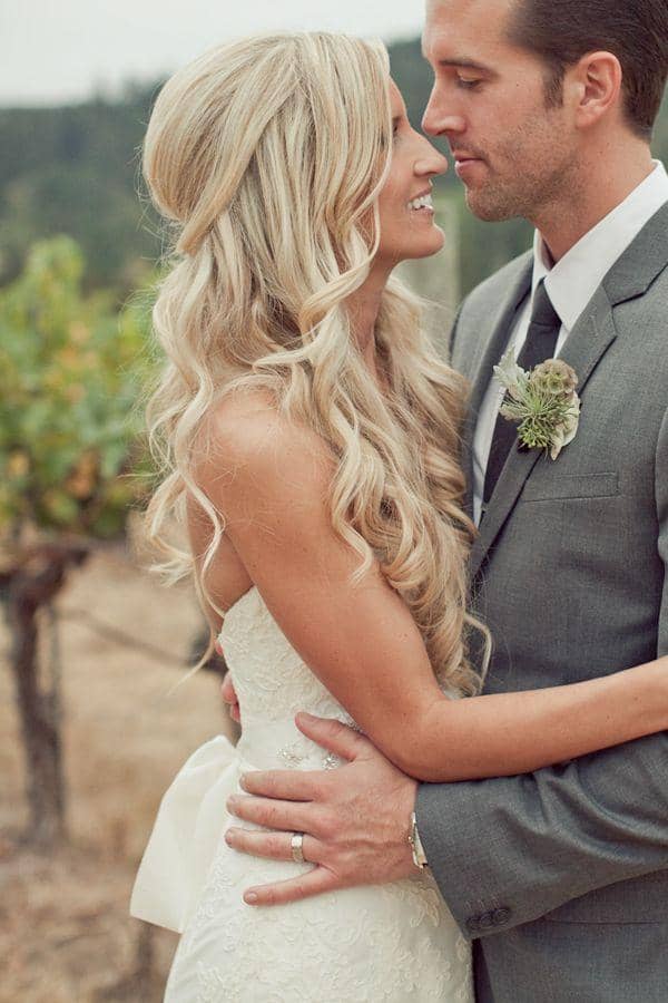 Bride with long hair in waves and her husband